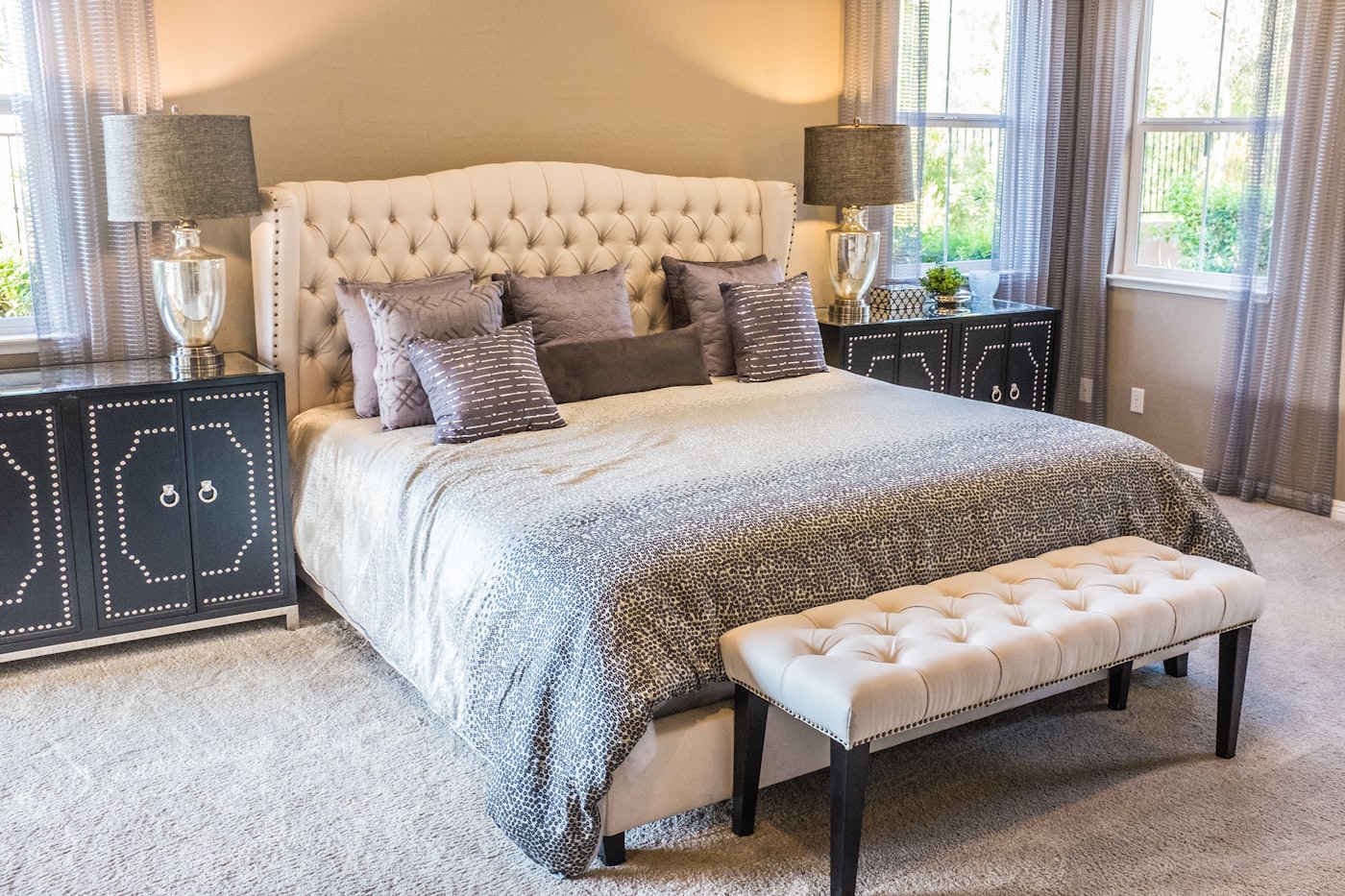 Bedroom with a wood headboard and warm lamplight